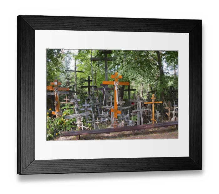 Framed Print : Cemetery full of wooden crosses surrounded by lush nature and trees Framed Print : Cemetery full of wooden crosses surrounded by lush nature and trees