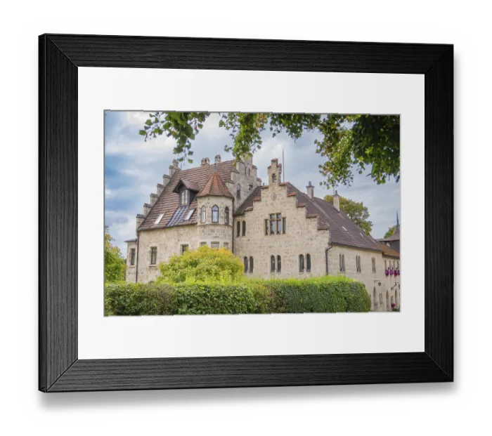 Framed Print : An old building with a red tiled roof and many windows Framed Print : An old building with a red tiled roof and many windows