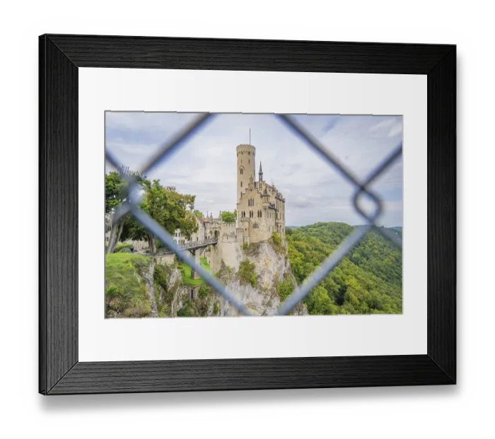 Framed Print : Castle on a hill, framed by green forest and viewed through a lattice Framed Print : Castle on a hill, framed by green forest and viewed through a lattice