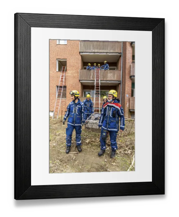 Framed Print : Rescue and recovery of people after a drone attack on residential buildings in a civil defence scenario