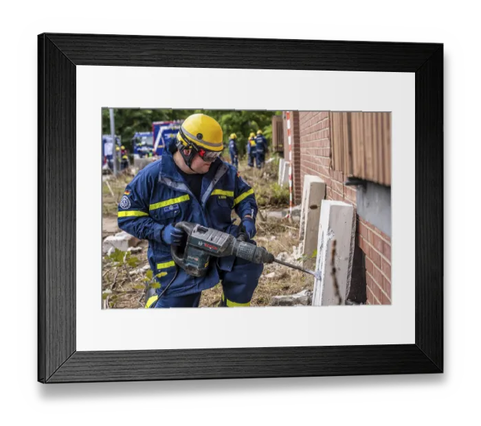Framed Print : Rescue and recovery of people after a drone attack on residential buildings in a civil defence scenario