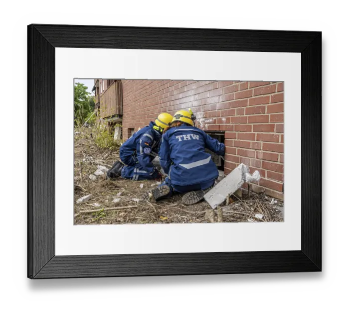 Framed Print : Rescue and recovery of people after a drone attack on a residential building in a civil defence scenario Framed Print : Rescue and recovery of people after a drone attack on a residential building in a civil defence scenario