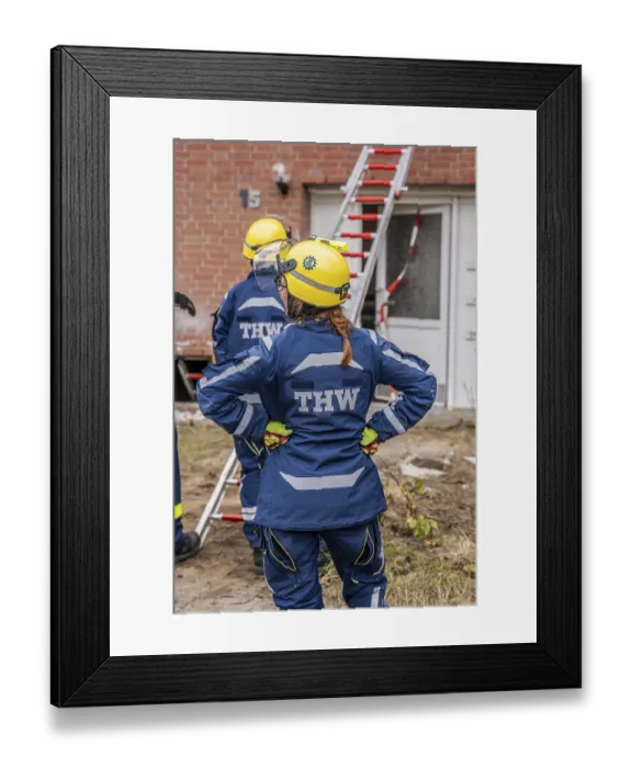 Framed Print : Rescue and recovery of people after a drone attack on residential buildings in a civil defence scenario