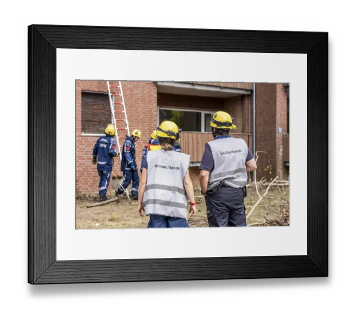 Framed Print : Rescue and recovery of people after a drone attack on residential buildings in a civil defence scenario