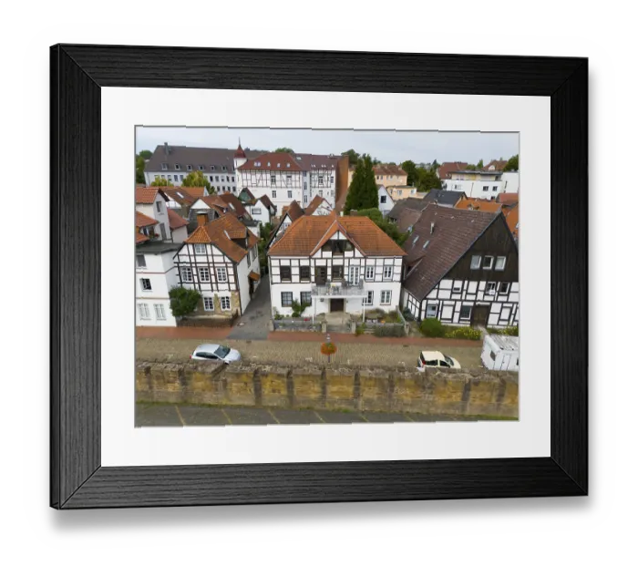 Framed Print : Half-timbered houses in an urban setting reflecting traditional European architecture Framed Print : Half-timbered houses in an urban setting reflecting traditional European architecture