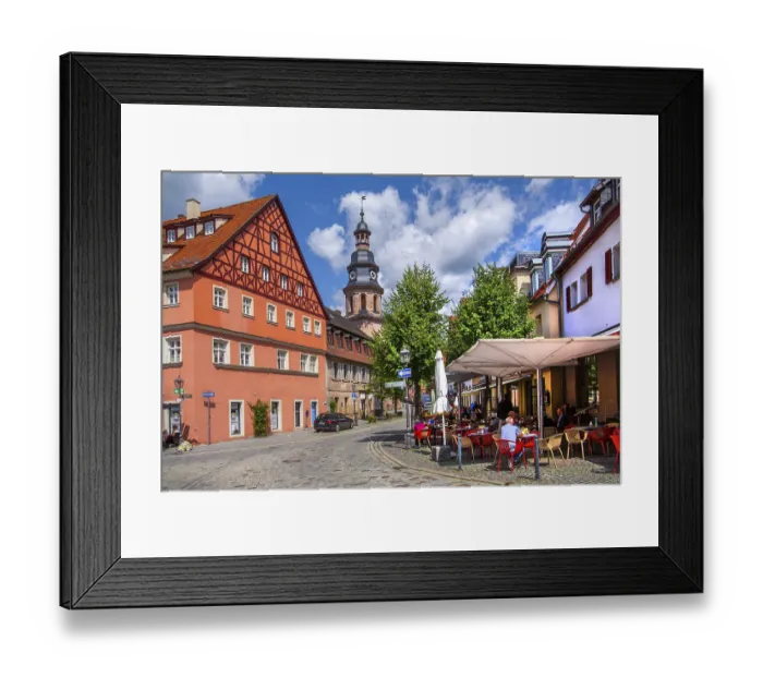 Framed Print : Half-timbered house with street cafe and hospital church in the old town