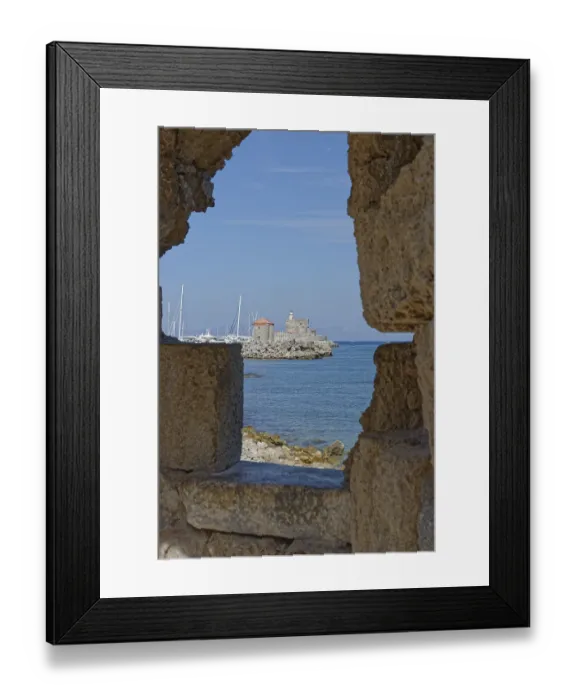 Framed Print : View through a wall of a medieval fort of Saint Nikolaos by the sea with sailing boats Framed Print : View through a wall of a medieval fort of Saint Nikolaos by the sea with sailing boats