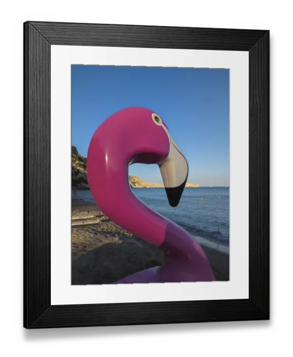Framed Print : Pink flamingo pedal boat on Tsambika sandy beach with sea in the background at sunset Framed Print : Pink flamingo pedal boat on Tsambika sandy beach with sea in the background at sunset