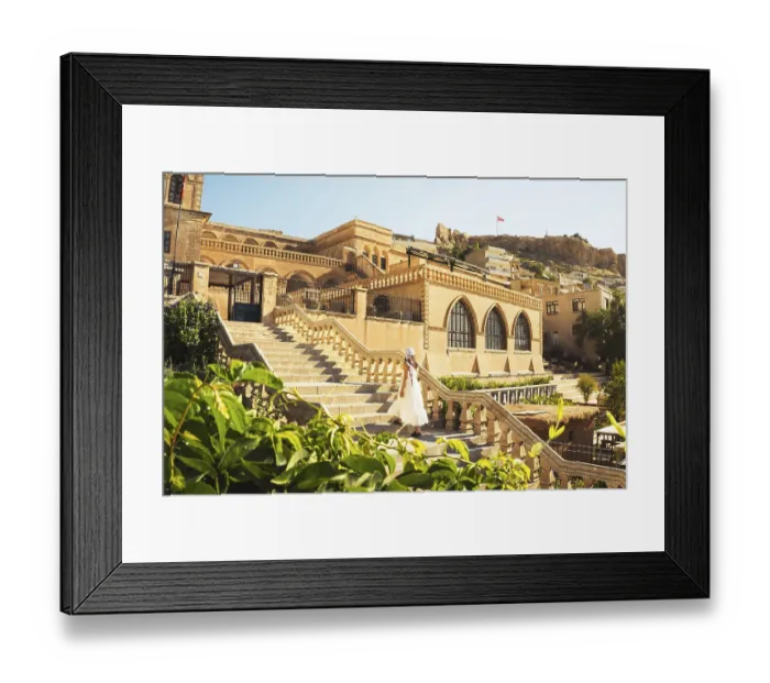 Framed Print : Traveler woman in white dress walking stairs of historic building - visit Mardin museum in old city of Mardin Turkey
