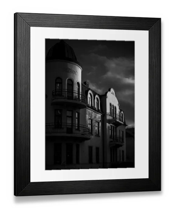 Framed Print : Historic European building in black and white with dramatic shadows and cloudy sky in Helsingborg