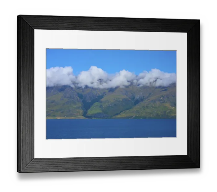 Framed Print : Mountains with a wreath of clouds over a blue lake under a clear sky