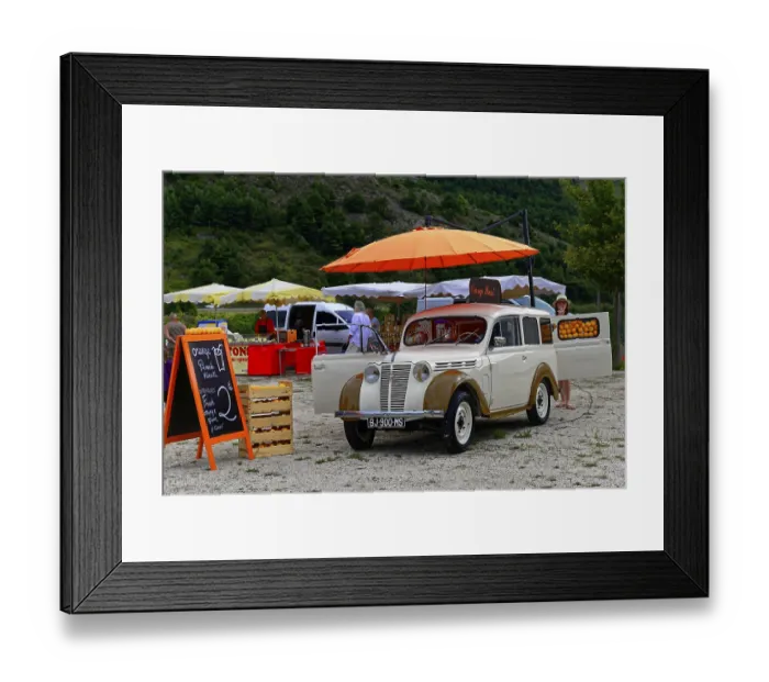 Framed Print : A white vintage car at a market