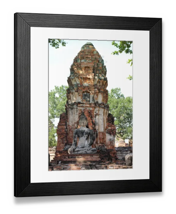 Framed Print : A Buddha statue seated before an ancient brick stupa Framed Print : A Buddha statue seated before an ancient brick stupa