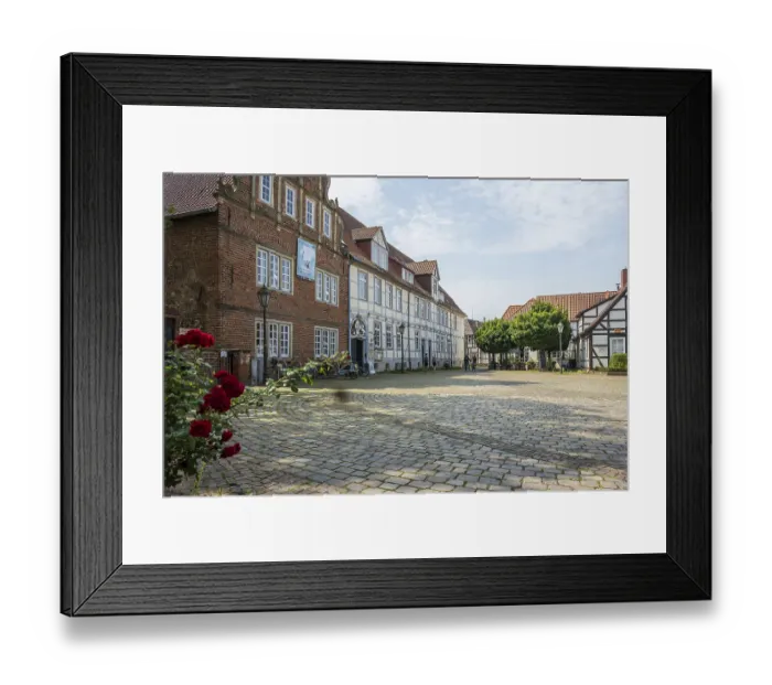 Framed Print : Historic half-timbered houses with cobbled square and roses Framed Print : Historic half-timbered houses with cobbled square and roses