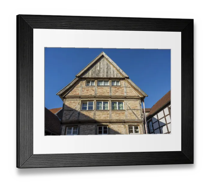 Framed Print : Large half-timbered house under a blue sky Framed Print : Large half-timbered house under a blue sky