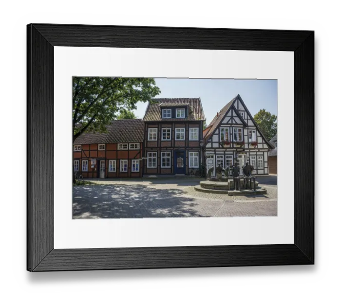 Framed Print : Row of traditional half-timbered houses along a quiet