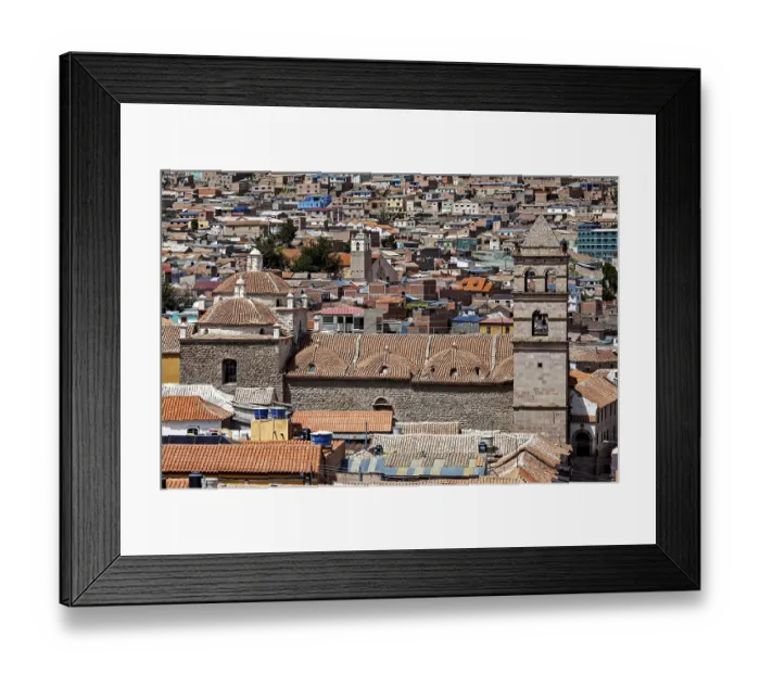 Framed Print : Densely built-up city scene with brick towers and colonial architecture in the foreground