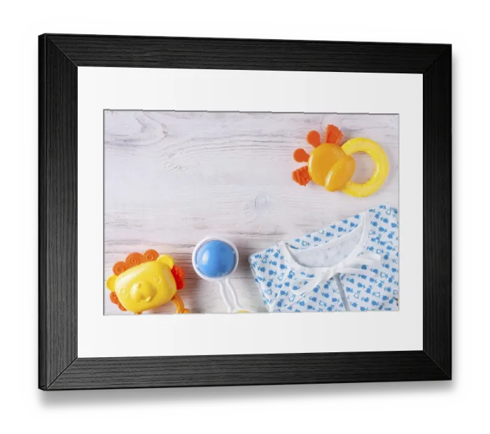 Framed Print : Things for a newborn on a white wooden background Framed Print : Things for a newborn on a white wooden background