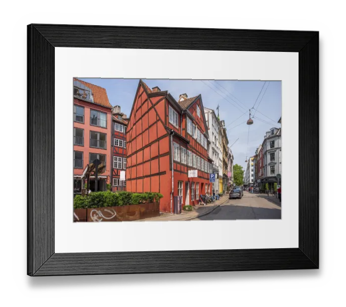 Framed Print : Old town street with historic, red half-timbered houses in a row