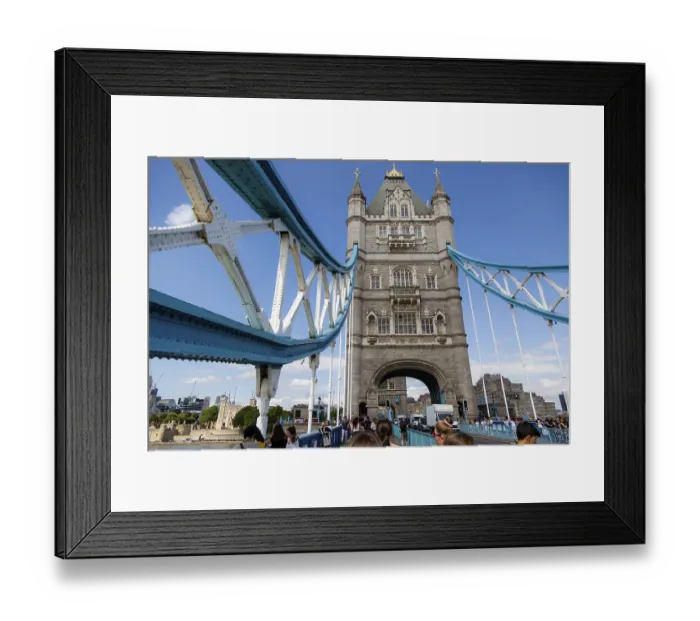 Framed Print : View of Tower Bridge with pedestrians passing through one of its towers in the City of London Framed Print : View of Tower Bridge with pedestrians passing through one of its towers in the City of London