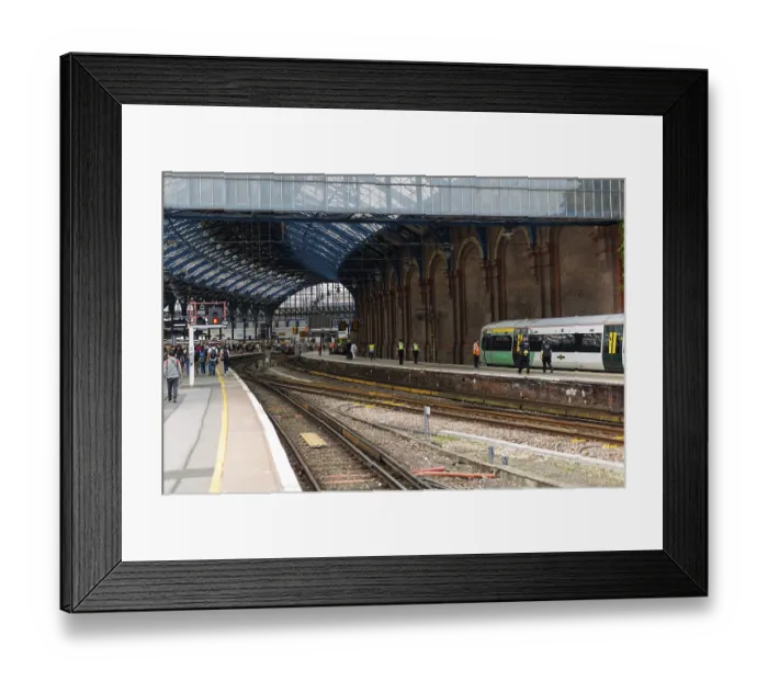 Framed Print : Train station with green train on the platform Framed Print : Train station with green train on the platform