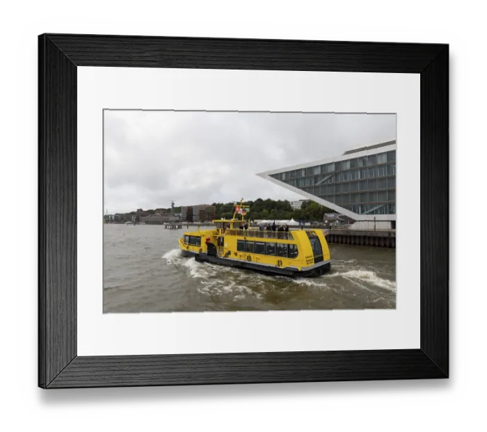 Framed Print : Passenger ferry Falkenstein of HADAG under grey skies on the Elbe in front of Dockland in the port of Hamburg