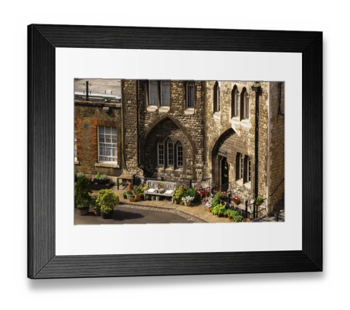 Framed Print : Quaint corner with cobblestone path and flowers near guard housing at The Tower of London Framed Print : Quaint corner with cobblestone path and flowers near guard housing at The Tower of London