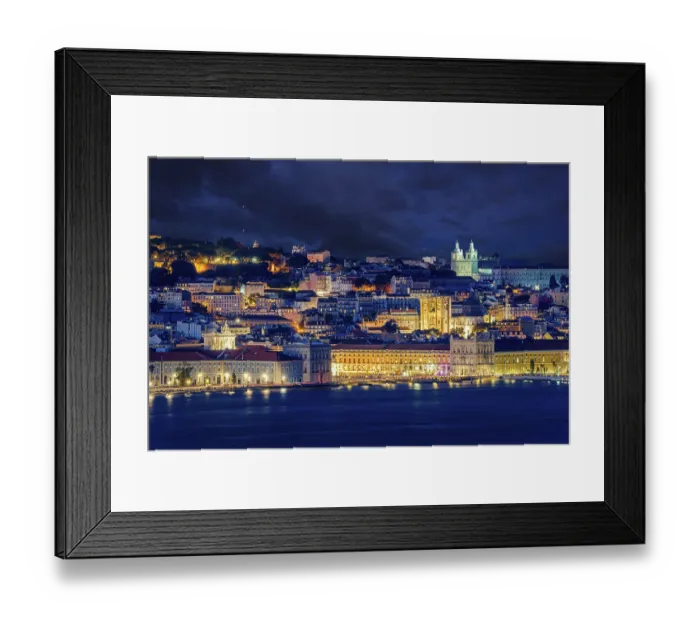 Framed Print : Lisbon historic old town with vibrant city lights under dramatic night sky