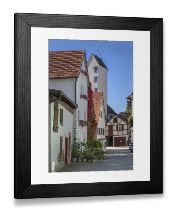 Framed Print : Romantic alley, cobblestones, pointed gable houses with half-timbered houses and floral decorations Framed Print : Romantic alley, cobblestones, pointed gable houses with half-timbered houses and floral decorations