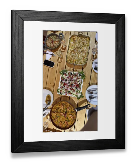 Framed Print : Rustic wooden table set with multiple homemade dishes including a large pan of seafood paella Framed Print : Rustic wooden table set with multiple homemade dishes including a large pan of seafood paella