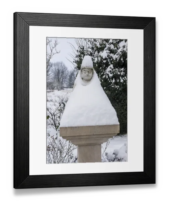 Framed Print : Buddha statue on a pillar has put on a snow coat