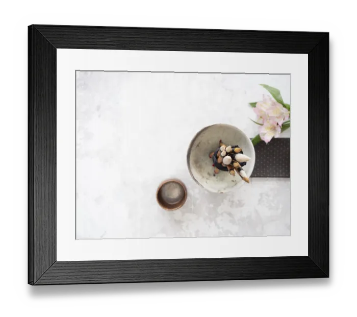 Framed Print : Calligraphy brushes tied with black ribbon in ceramic bowl near inkstone and pink flowers
