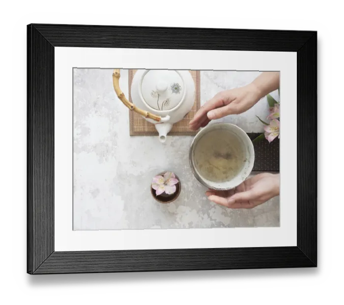 Framed Print : Woman gently holding a tea bowl during a traditional japanese tea ceremony