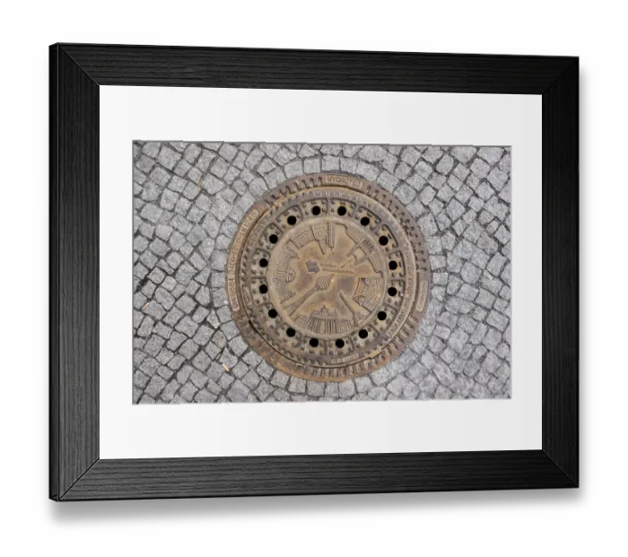 Framed Print : Sewer cover of Berliner Wasserbetriebe with architectural sights of the capital Framed Print : Sewer cover of Berliner Wasserbetriebe with architectural sights of the capital