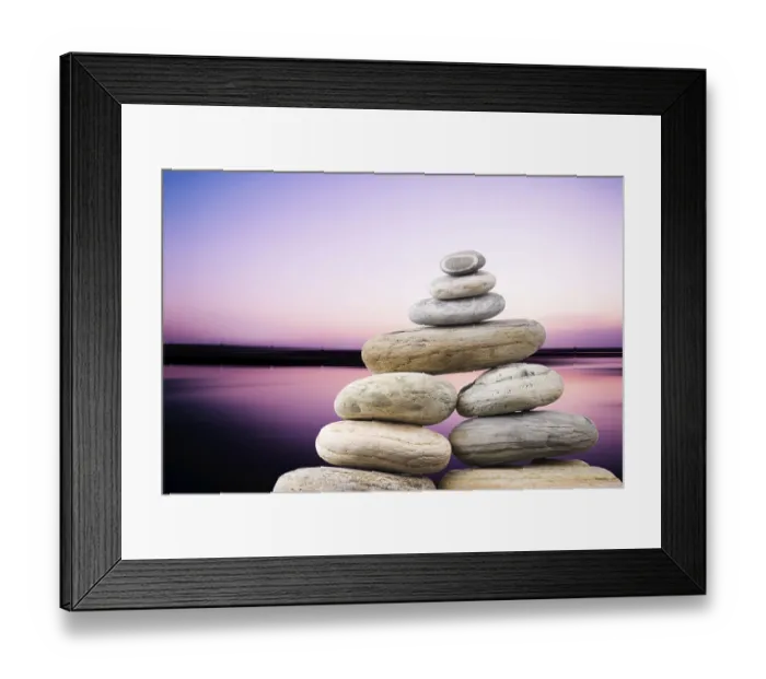 Framed Print : Pebbles stack in peaceful evening with smooth ocean background Framed Print : Pebbles stack in peaceful evening with smooth ocean background