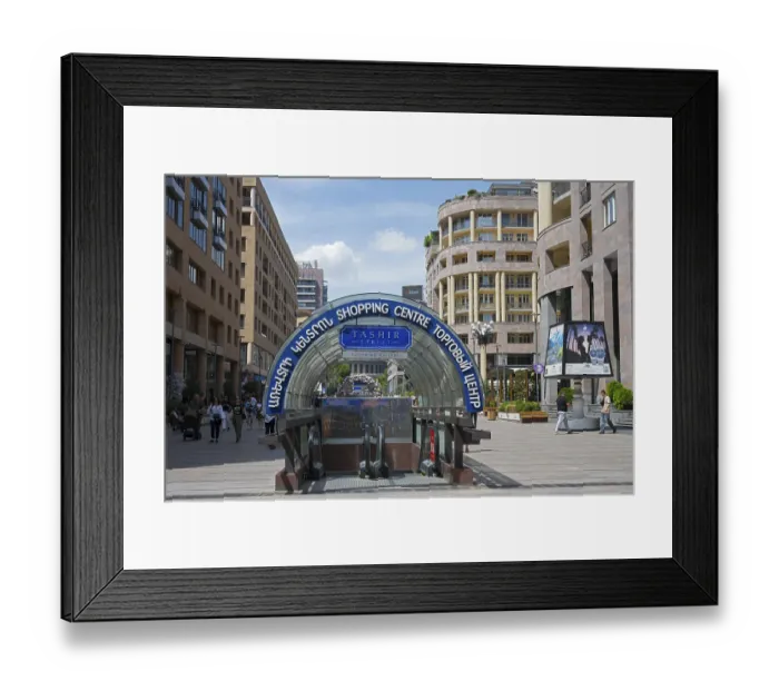 Framed Print : Entrance to a shopping centre with a modern architectural style in a lively environment