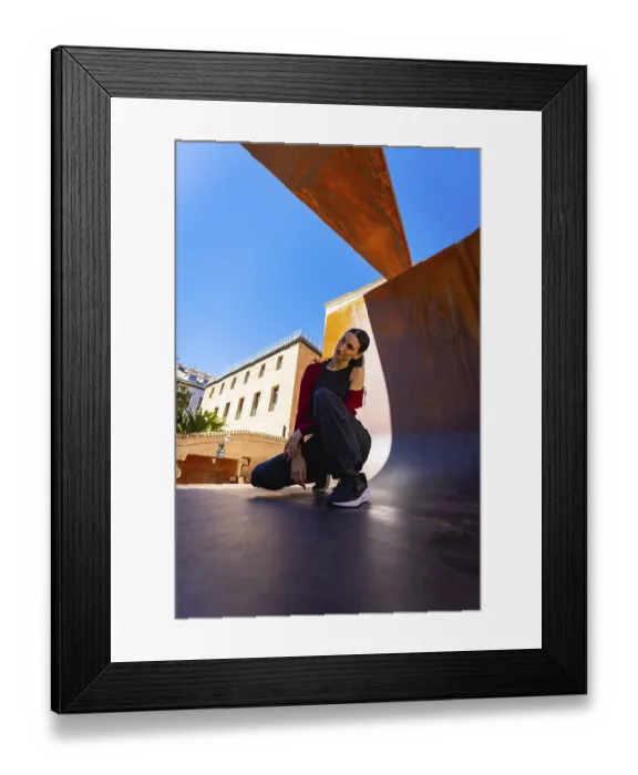 Framed Print : Young woman posing in a modern city environment Framed Print : Young woman posing in a modern city environment