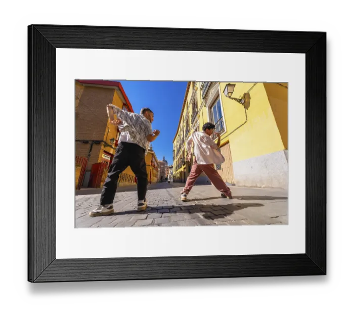 Framed Print : Two young men expressing themselves through street dance movement