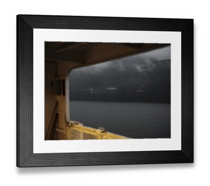 Framed Print : Gloomy mountain landscape viewed from inside a ship amid heavy clouds in Horseshoe Bay Framed Print : Gloomy mountain landscape viewed from inside a ship amid heavy clouds in Horseshoe Bay