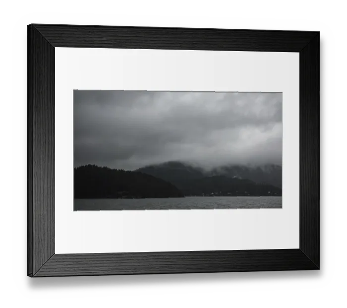 Framed Print : Moody seascape with a mountainous backdrop under a dense gray cloud cover as seen from a passenger ferry crossing Framed Print : Moody seascape with a mountainous backdrop under a dense gray cloud cover as seen from a passenger ferry crossing