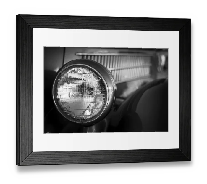 Framed Print : Close-up of a vintage car headlight and grille in black and white in St Framed Print : Close-up of a vintage car headlight and grille in black and white in St
