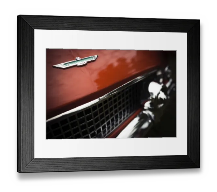 Framed Print : Detailed view of a red vintage Ford Thunderbird logo and grille with chrome elements in St