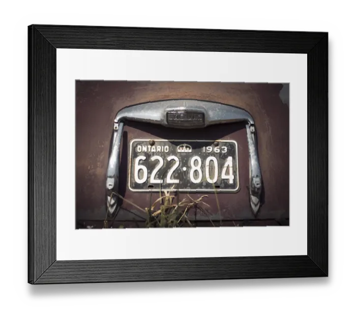 Framed Print : Ontario license plate on a vintage Jaguar car with visible rust and age in rural Huron County