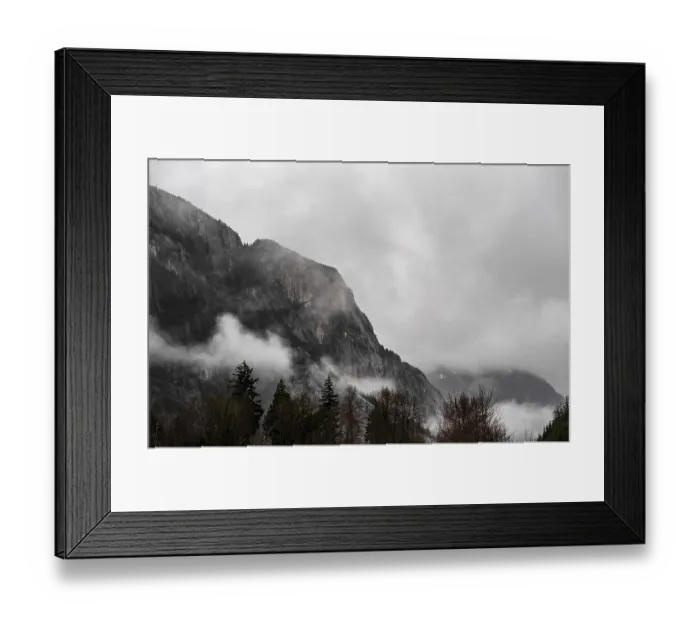 Framed Print : Misty mountains with fog rolling over forested slopes under cloudy skies along the lower mainland coast in British