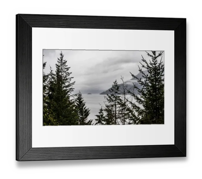 Framed Print : Overcast skies above a scenic view of a lake with islands