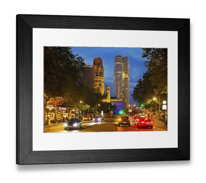 Framed Print : Budapester StraBe with Kaiser Wilhelm Memorial Church and Upper West Tower in the evening