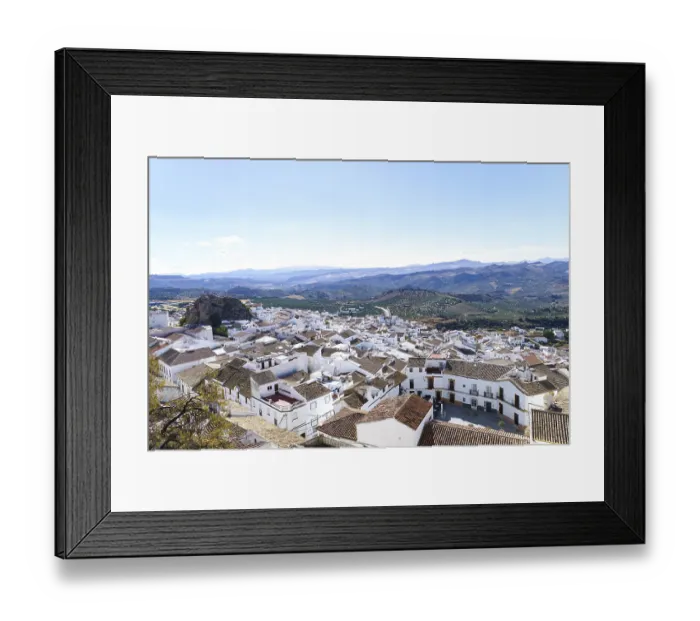 Framed Print : Olvera town displaying traditional white houses under a clear sky in olvera