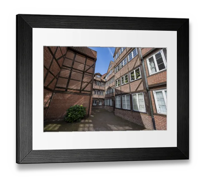 Framed Print : Facades of the historic brick buildings