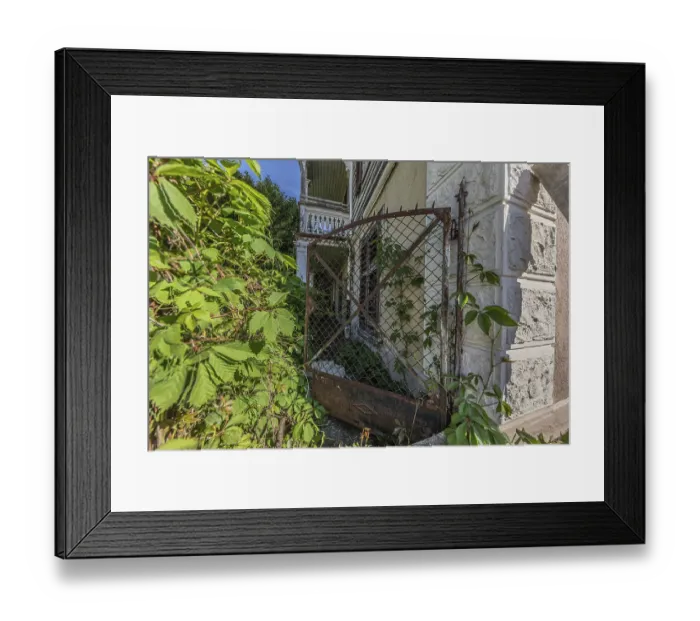 Framed Print : Old garden gate of a multi-storey residential building built in 1903 in front of demolition Framed Print : Old garden gate of a multi-storey residential building built in 1903 in front of demolition
