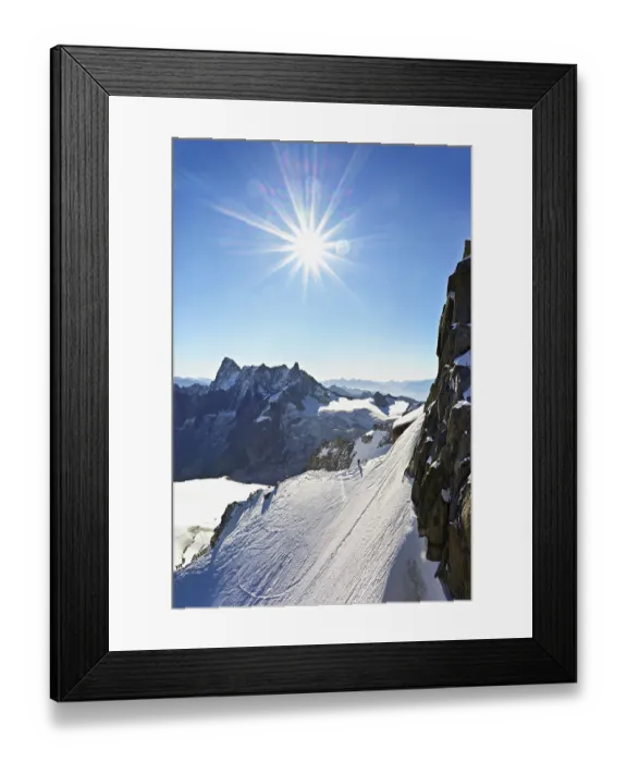 Framed Print : Mountaineers climb over a snow-covered ridge